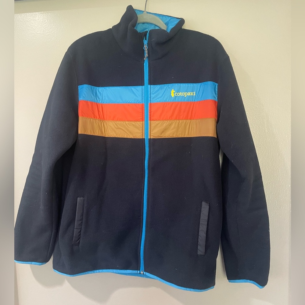 cotopaxi Black Jacket with Blue, Orange & Tan Stripes